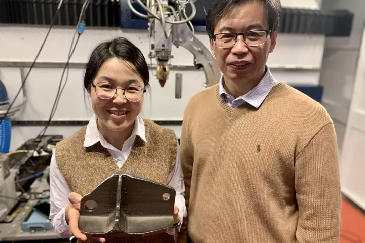 Tingting Song and Ma Qian (left to right) with a titanium alloy part created with the laser 3D printer that the team used at RMIT University. Note: this is not an alloy part that the team made for this research