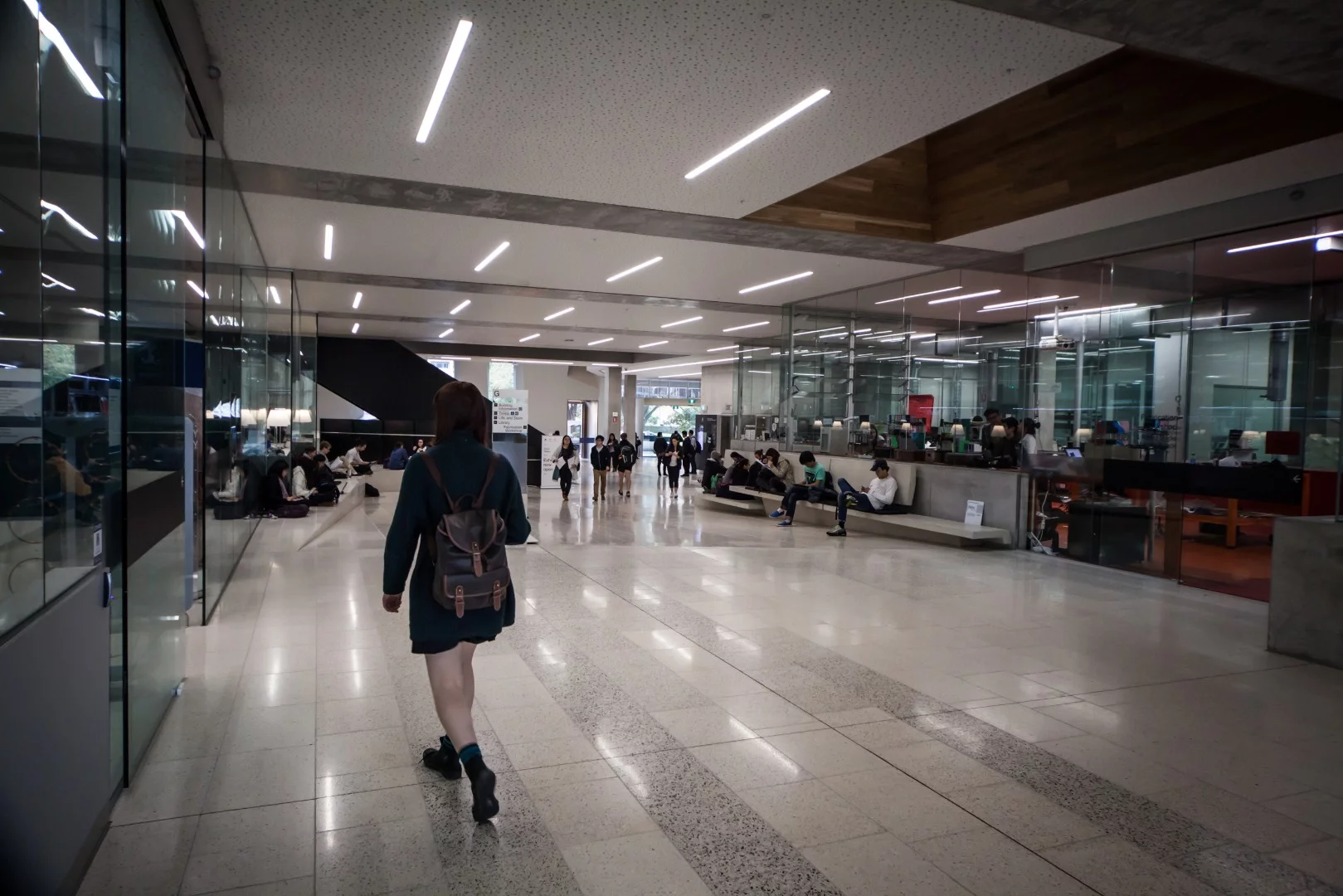 On the ground floor of the building, a thoroughfare handles foot traffic from all across the university