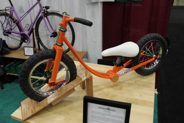 This tiny balance bike from Shamrock Cycles could easily be missed, however – the card at the front explained how it was made for the (fictitious) sport of baby bicycle racing (Photo: Ben Coxworth/Gizmag.com)