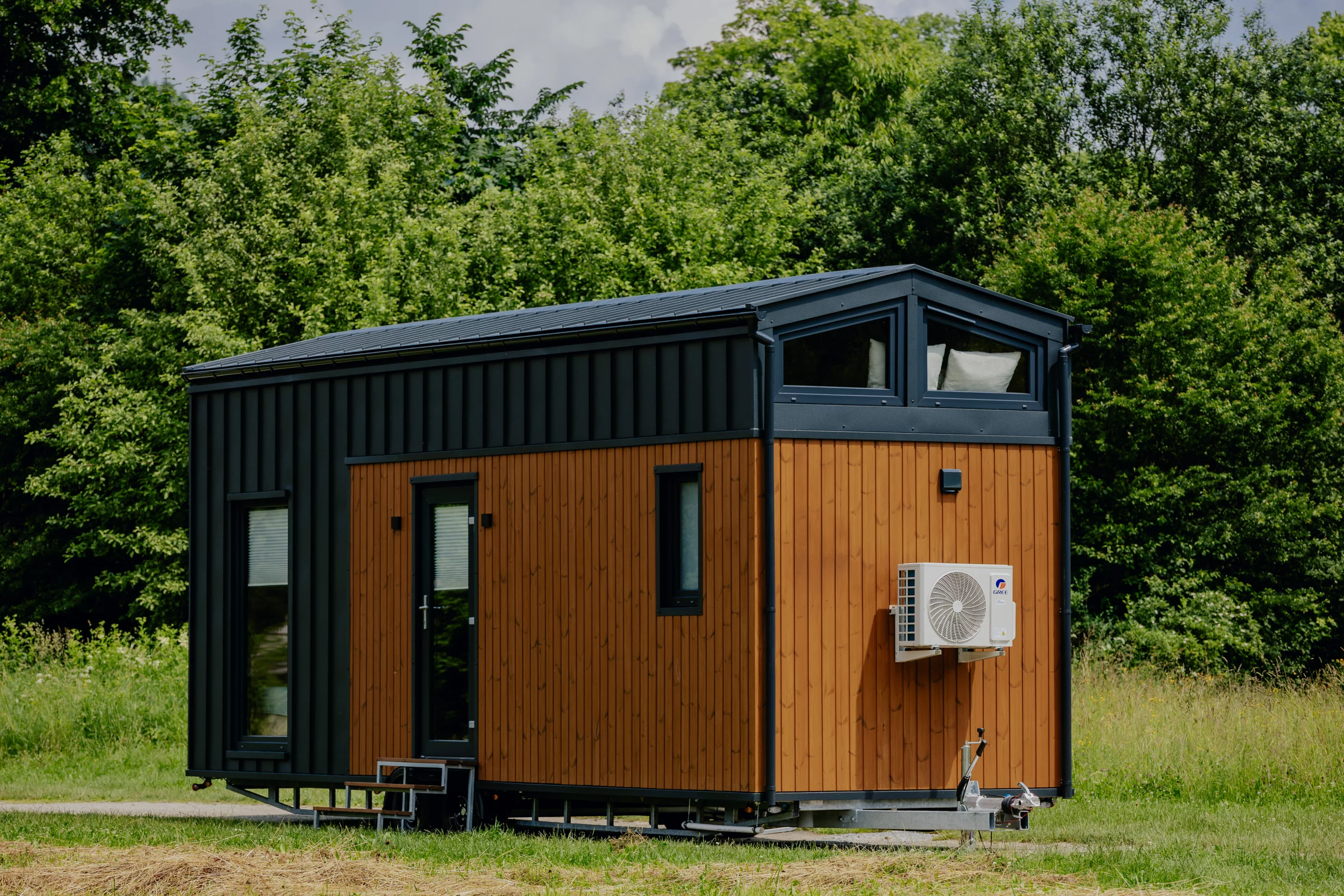The Alan's exterior is clad in engineered wood and metal, with a metal roof