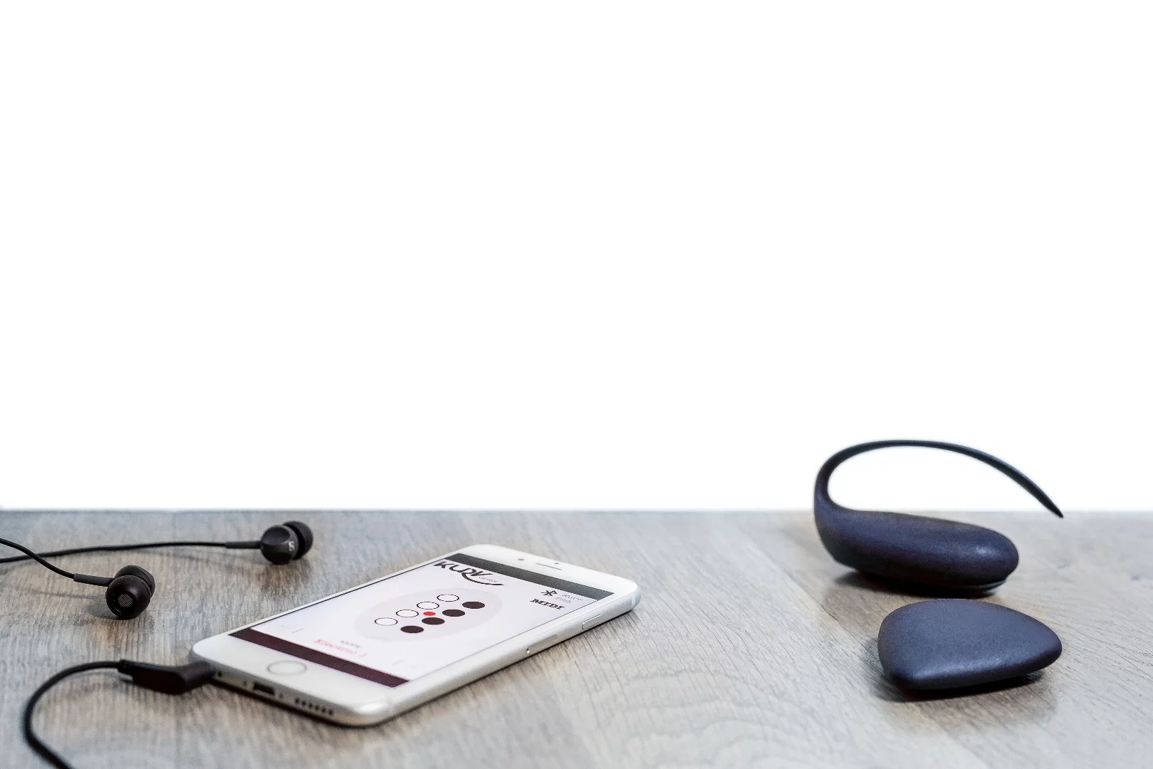 The physical Kurv components wirelessly connect to an iOS device running a companion app