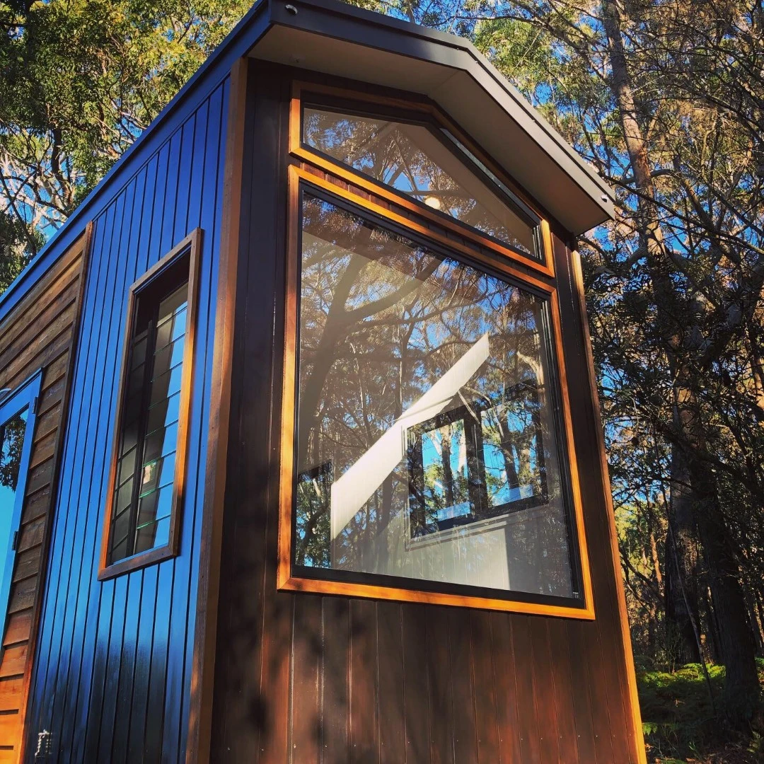 The dwelling is clad with two types of locally-sourced cedar timbers to create its dramatic look
