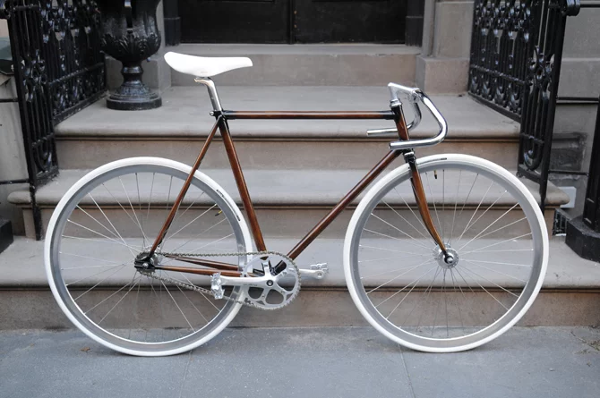 New Zealand's Rob Pollock hand-paints clients' bicycle frames with a faux woodgrain finish