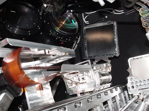 LUCIFER's multi object spectroscopic unit, with the robot grabbing a mask from the storage magazine
