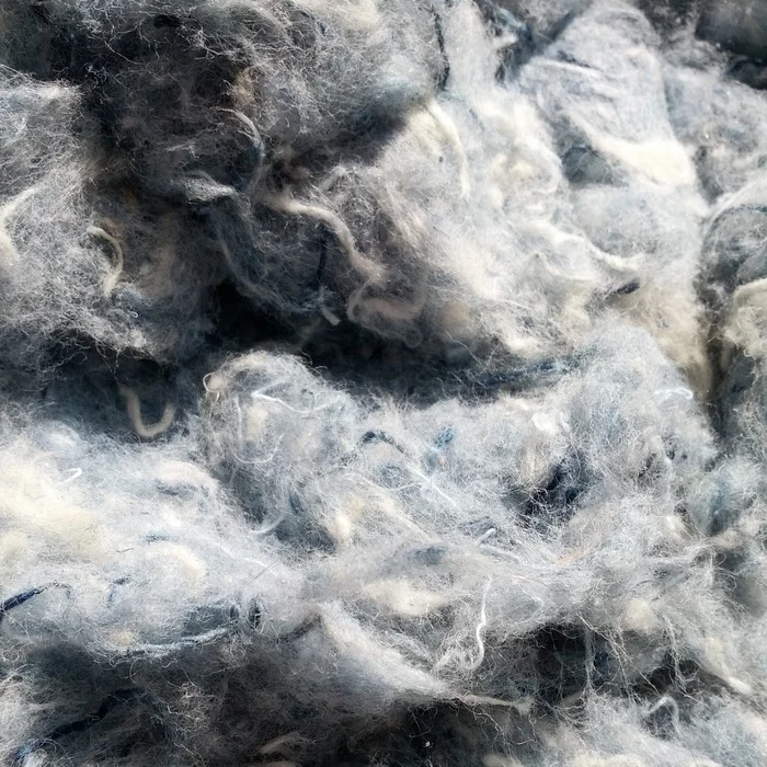The raw recycled denim, which is also used for building insulation