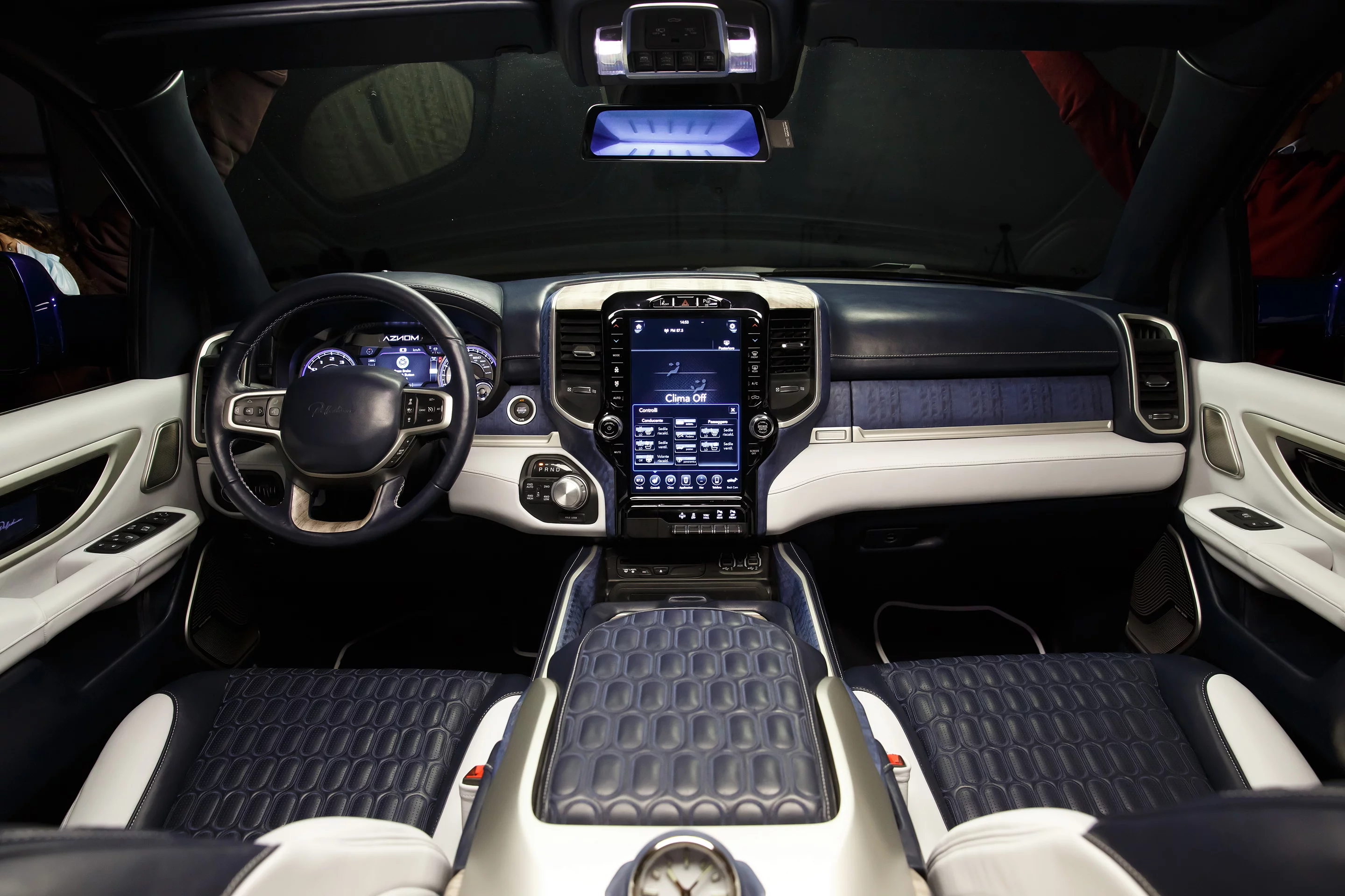 Up front, Aznom dresses the Ram cabin in fancy materials and complements the tablet-style infotainment system with a door panel touch control pad