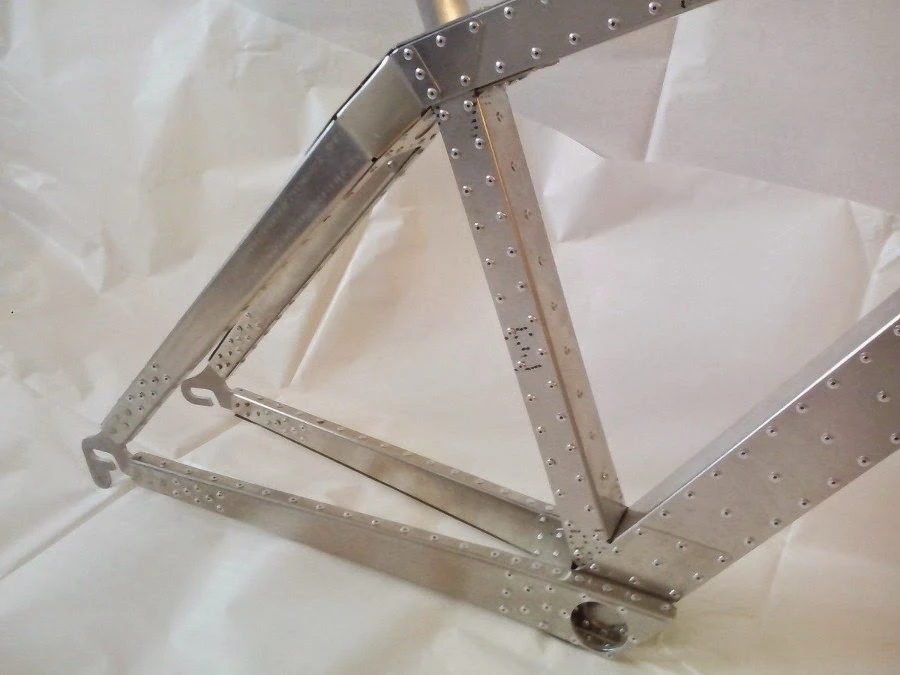 The resulting flat pieces of metal are subsequently folded and molded into the desired shape, then riveted and glued into place
