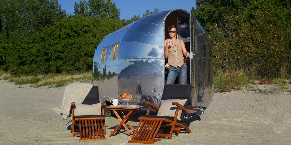 The dining table is detachable for outdoor meals