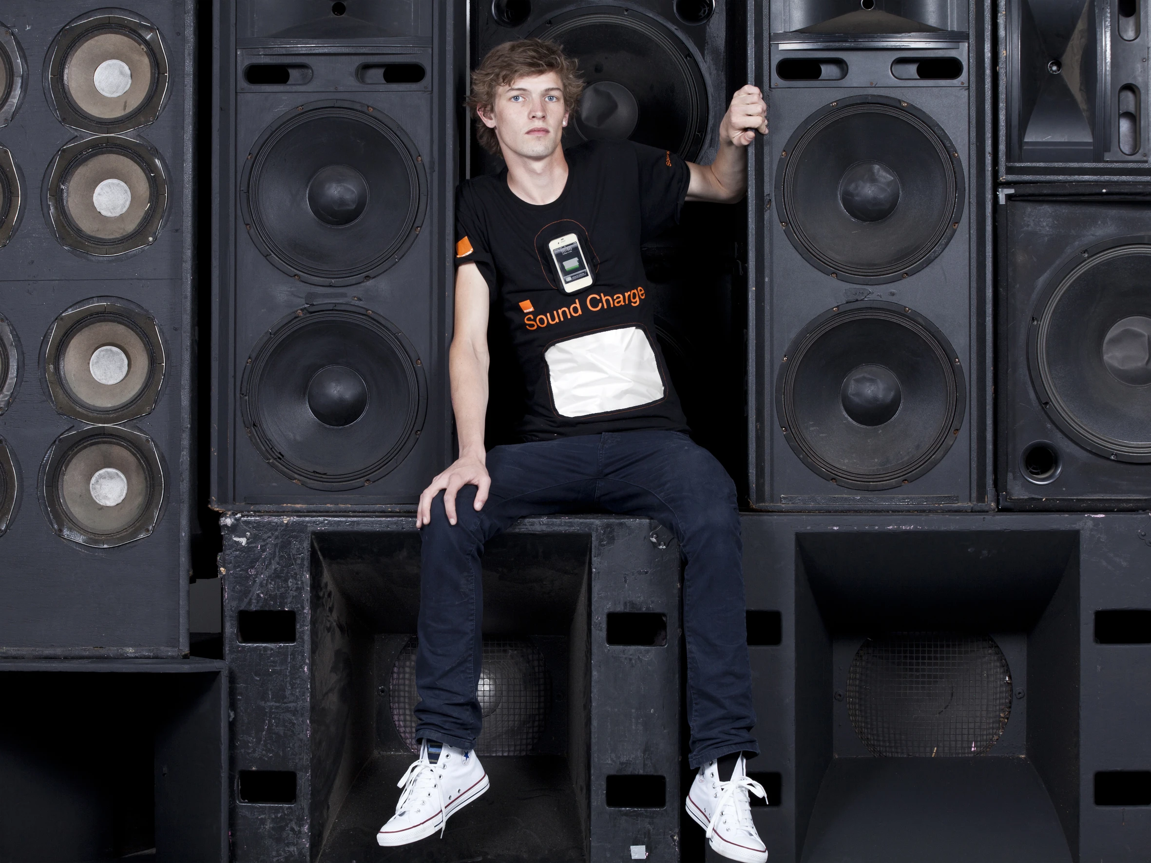 Orange and GotWind have developed a prototype mobile device charging t-shirt that uses Piezoelectric film to convert sound waves into electric charge