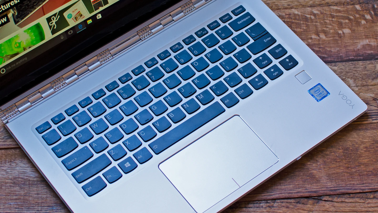 The Yoga 910's keyboard is big and easy to type on, but the right Shift and arrow keys are a little jumbled to make room for the fingerprint sensor
