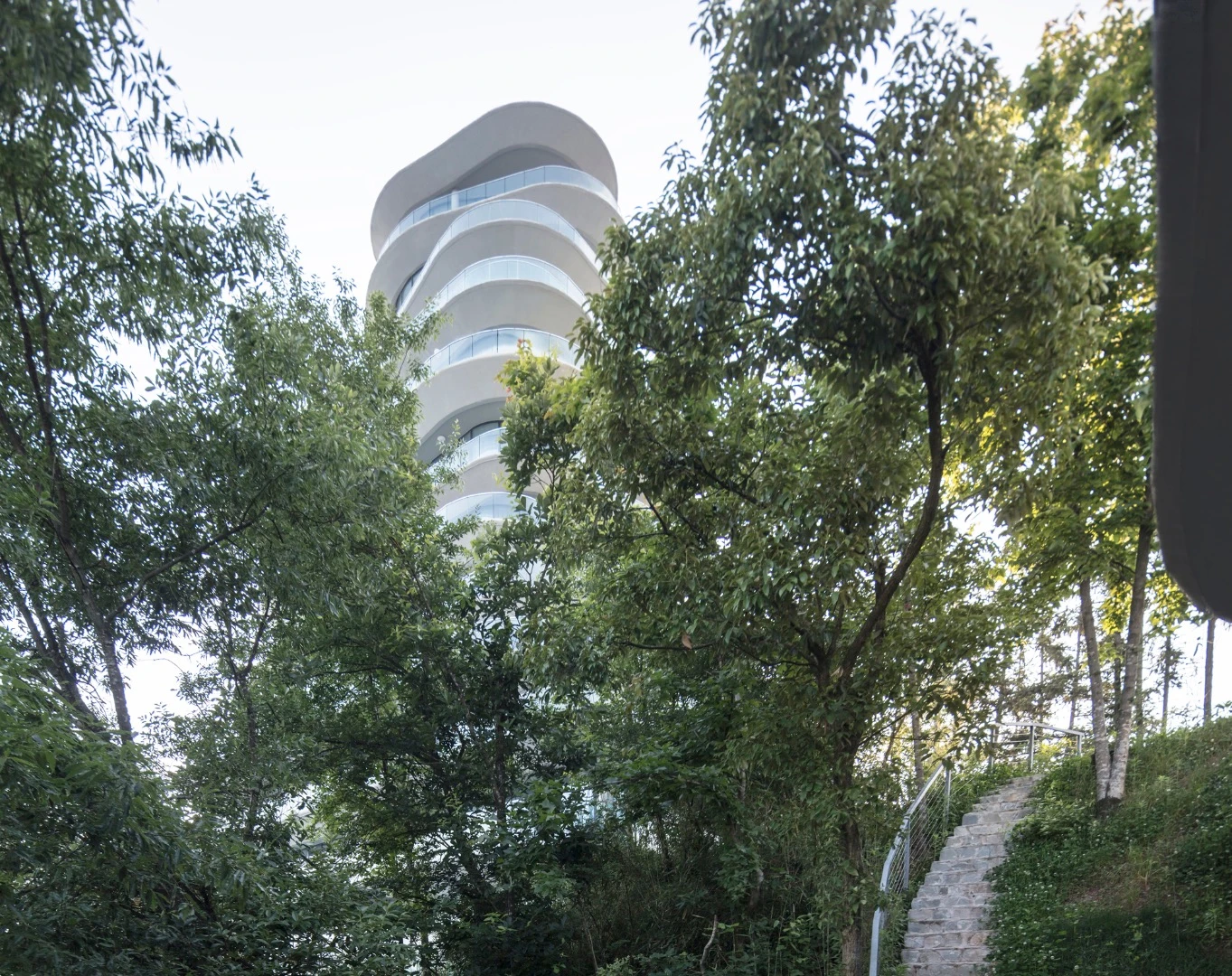 The Huangshan Mountain Village's shape is informed by tea fields and no two buildings are identical