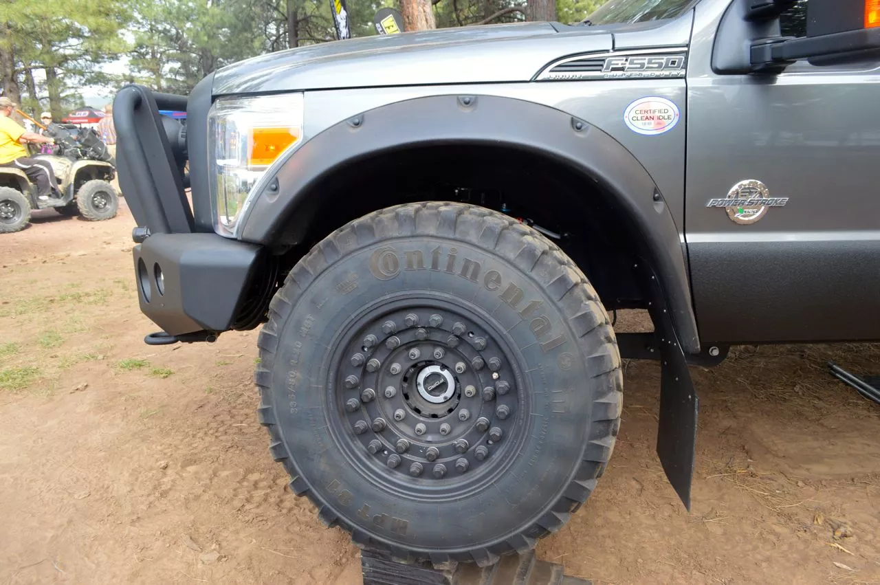 The 41-in Continental MPT-81 tires mounted to military headlock rims offer a minimum ground clearance of 12.4 in (31.5 cm)