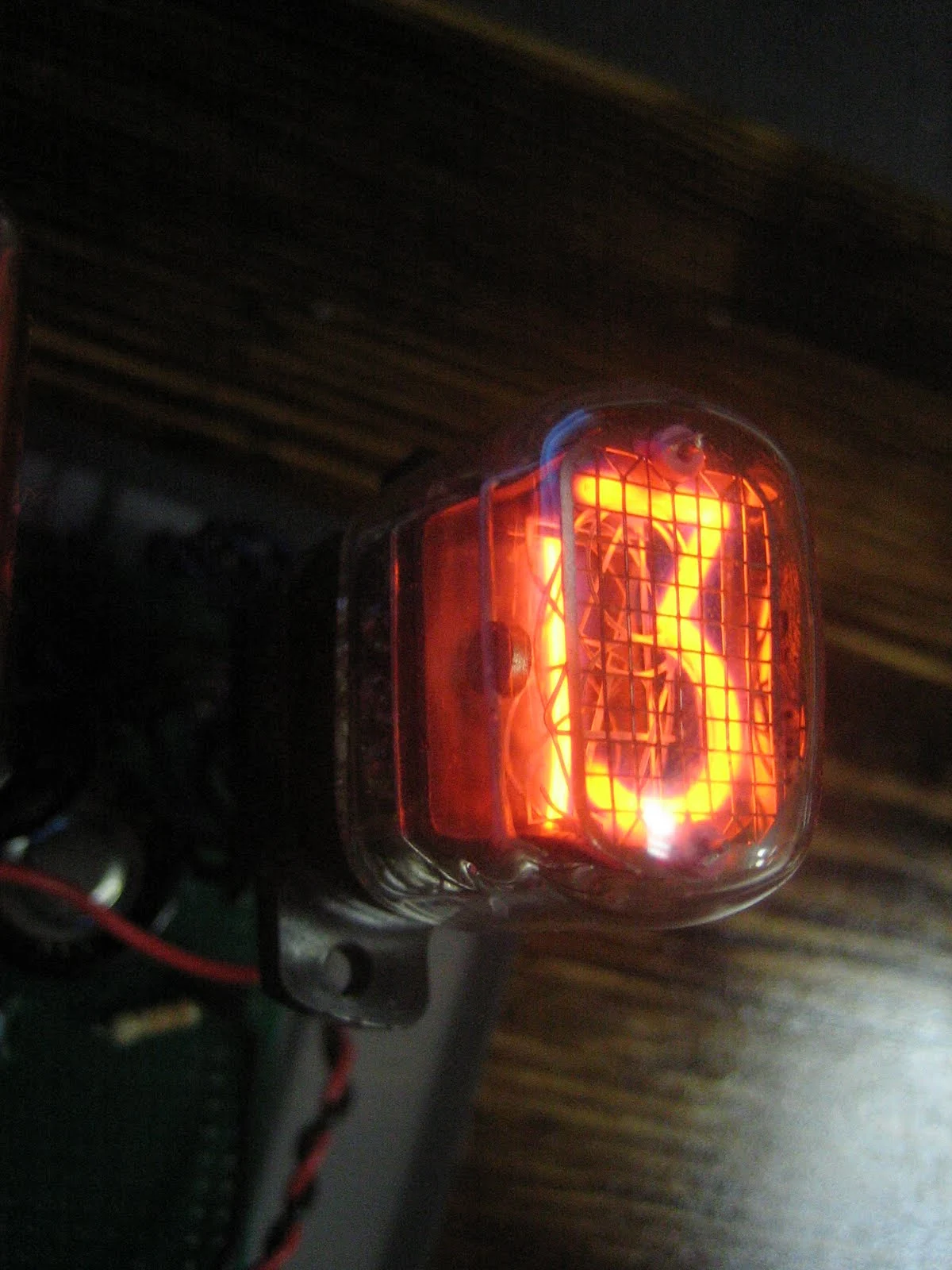 A nixie tube proudly displays the number 3