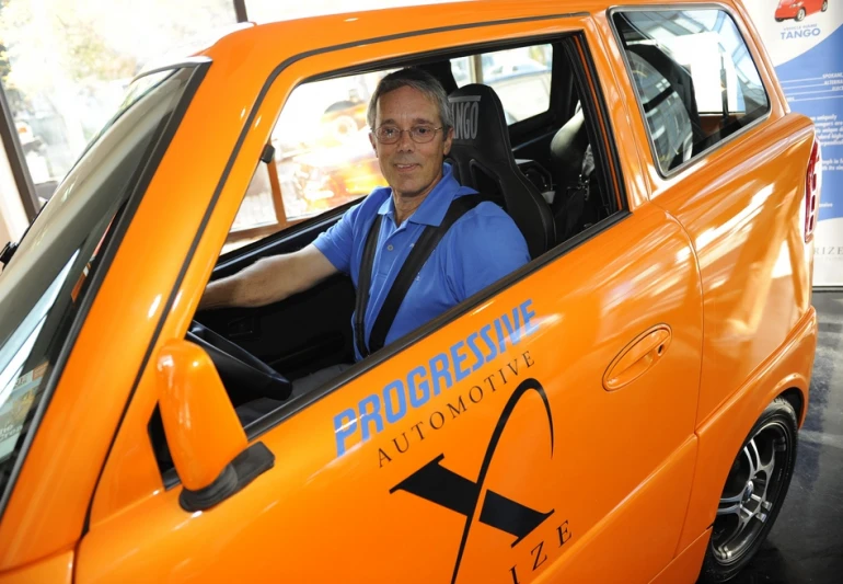Commuter Cars President Rick Woodbury in his Tango electric vehicle