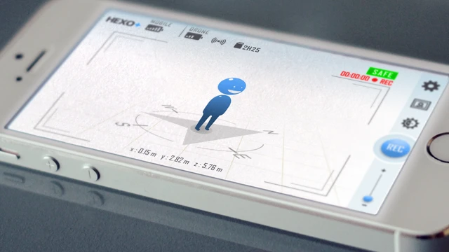 The user utilizes an included app to indicate the perspective from which they wish to be filmed