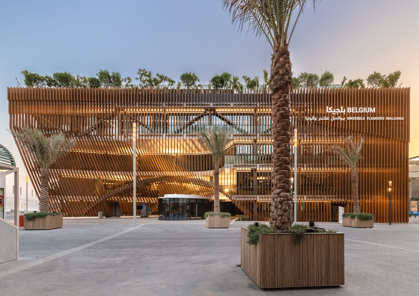 The Green Arch is finished in 5.5 km (3.4 miles) of wooden louvers to help shade it from the hot Dubai Sun