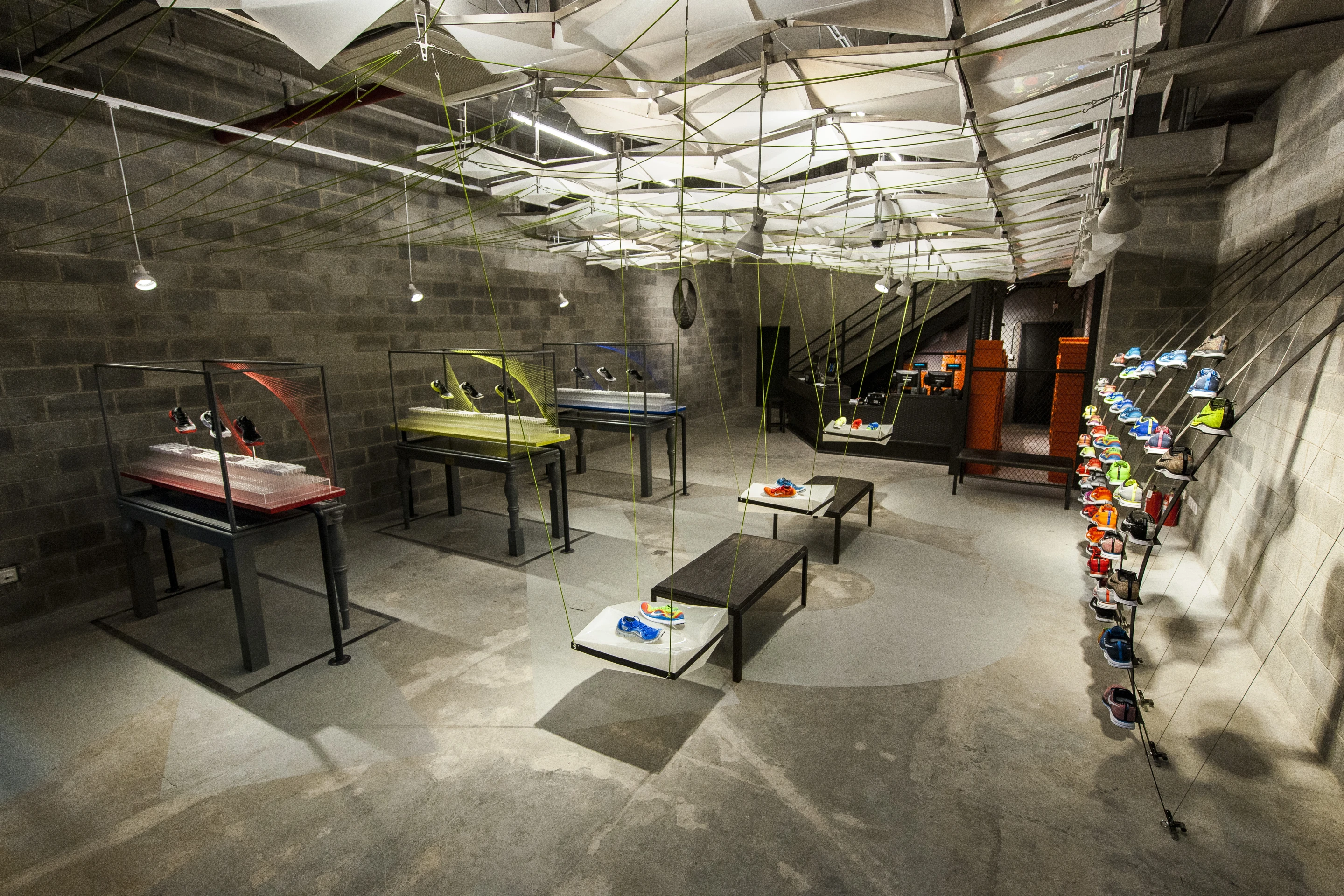 Nike's X158 Hyper Nature concept store features an interior constructed using materials recycled from DVDs, water bottles, and beverage cans