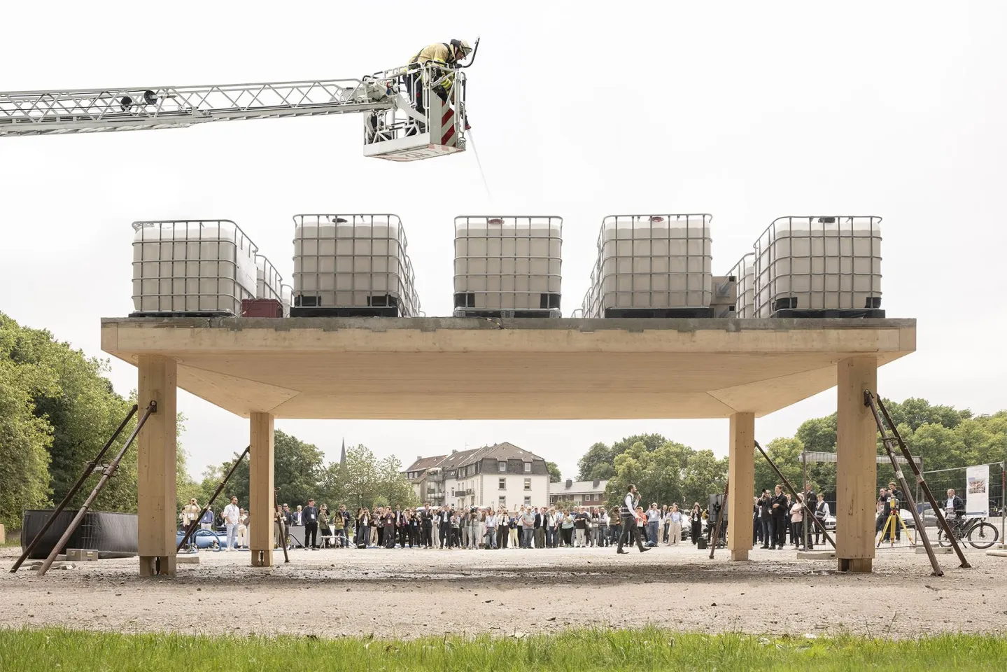 The system was demonstrated using a 29.5 x 16.4 ft composite slab loaded with 20 tons of weight