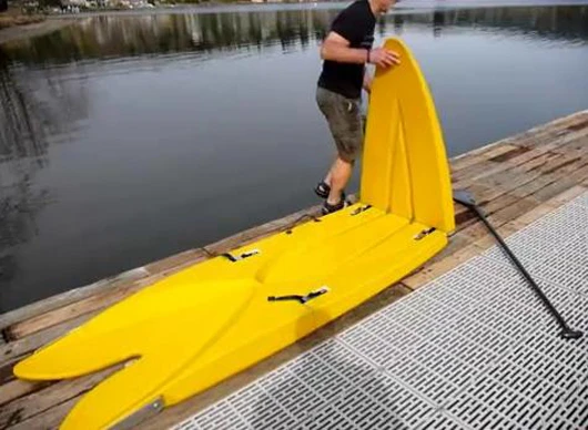 The Origami Paddler's tip and tail fold out and lock into place via patent-pending strap hinges