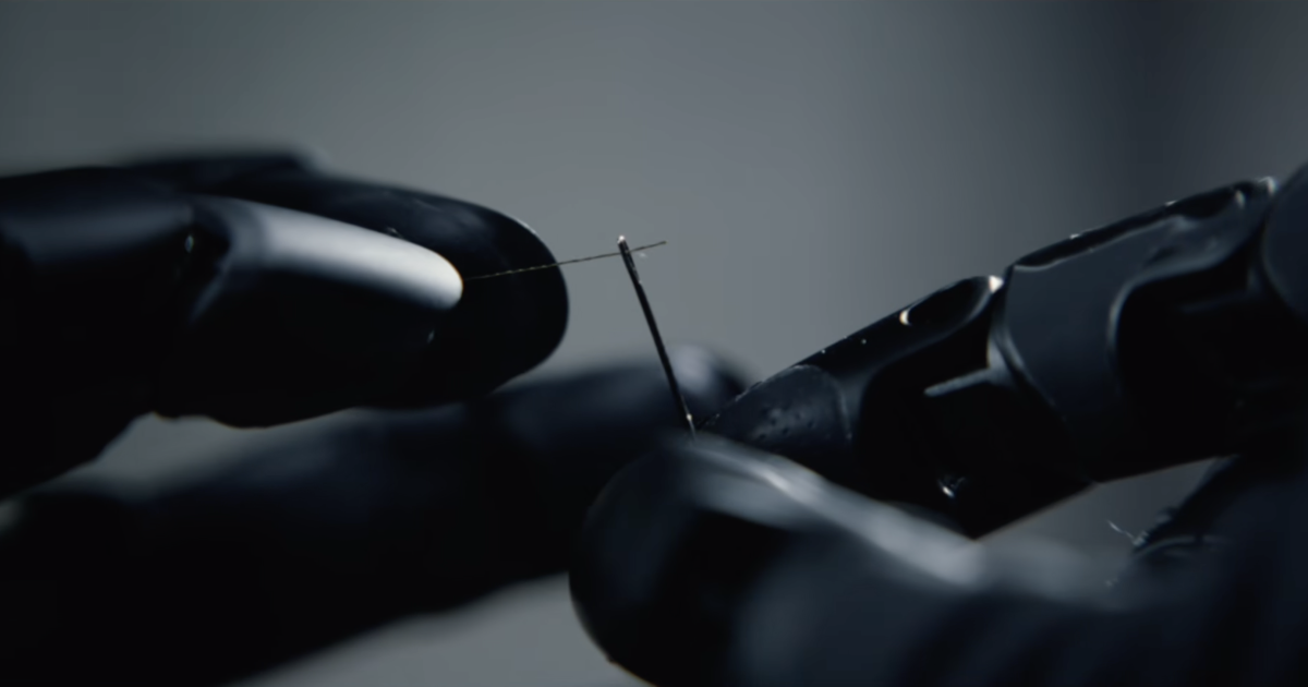 Photograph accompanying AGILINK's OmniHand 3 Ultra splits silk into 16 strands in an embroidery demo