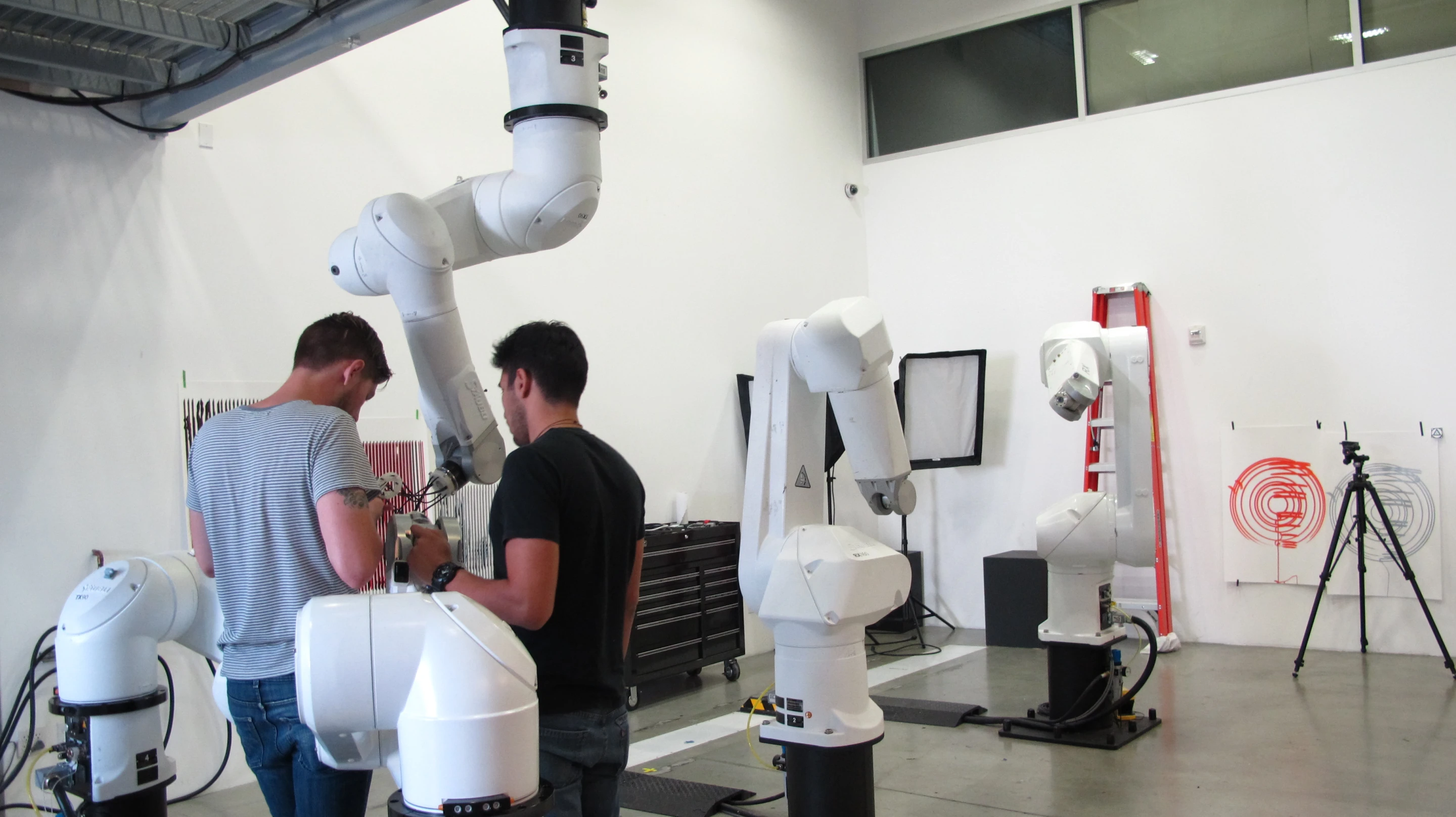 Students applying fittings and materials created using the 3D printer to the robotic arms (Photo: Phyllis Richardson)
