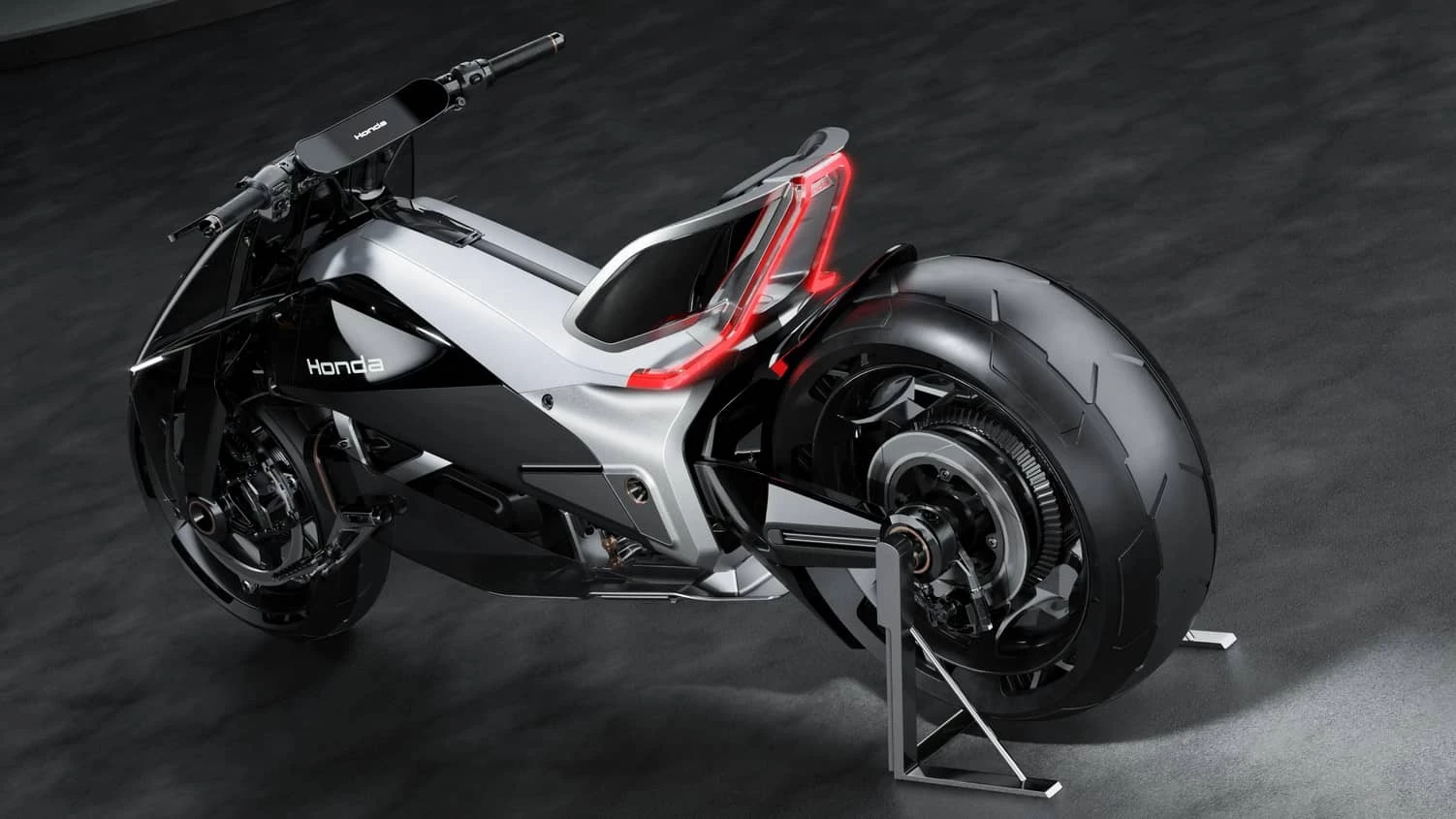 The concept is based around an aluminum chassis and a rear swingarm. The battery pack is centrally positioned and hangs low within that aluminum frame.