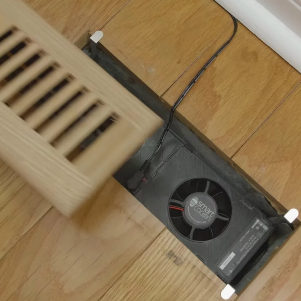 The SmartCocoon Smart Register Booster Fan is designed to sit inside standard vent spaces