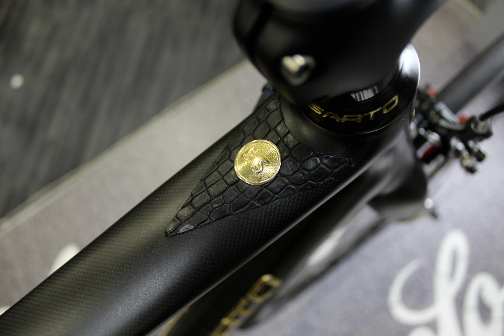 The owner's initials are imprited in gold on the Sarto 18K