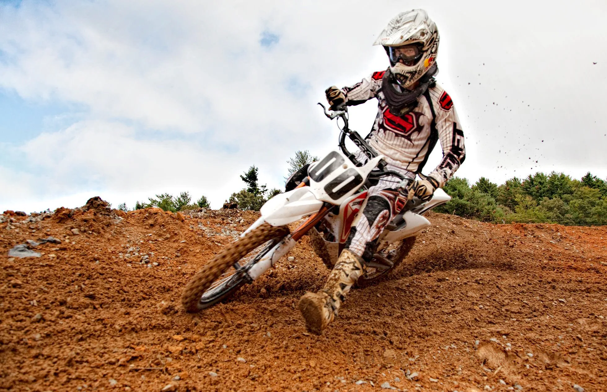 Cornering and kicking up dust on a Zero MX electric bike at the Dark Green track in Penrose, North Carolina