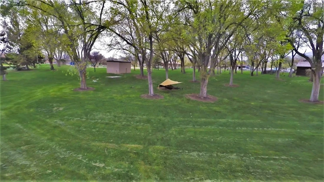 The Treble Hammock 2.0 attaches to three roughly triangular points – usually trees – using strapping