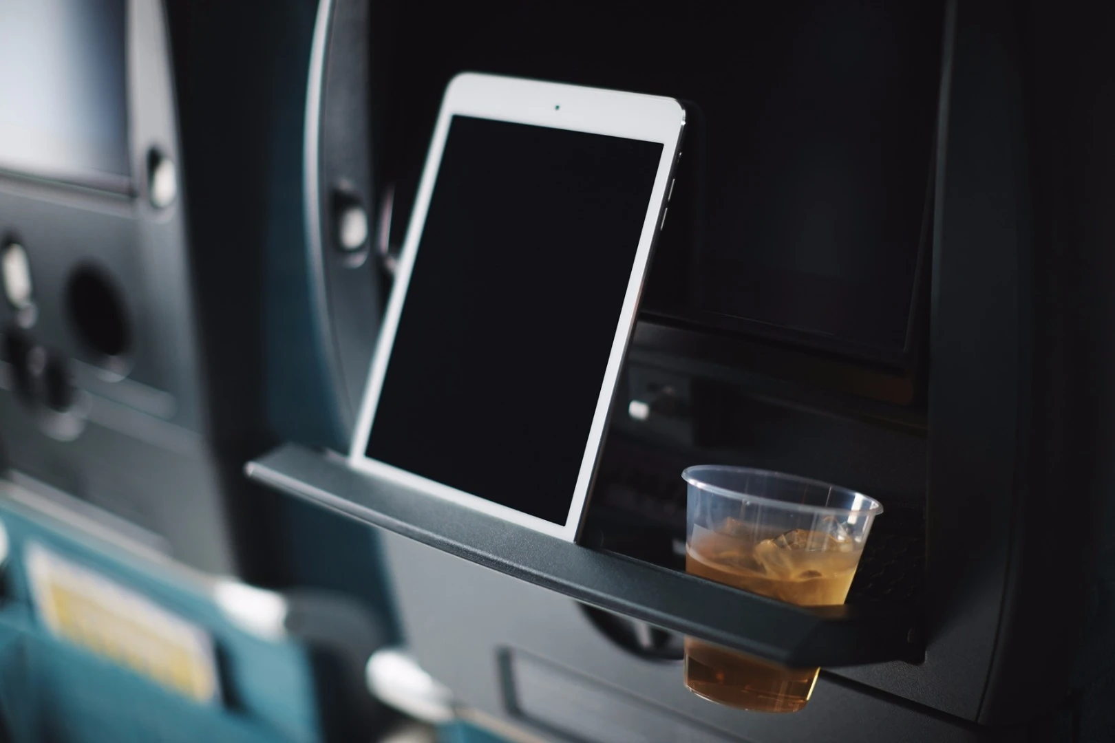 The seats have a stand for tablets and smartphones built into their backs