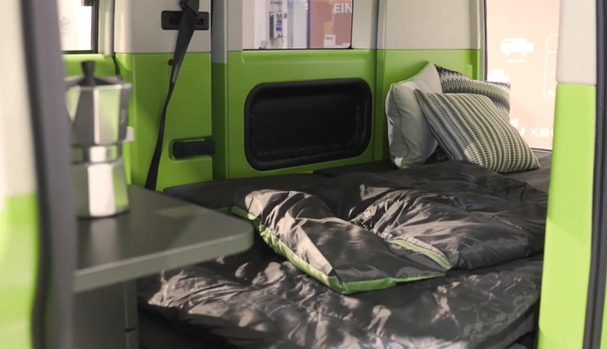 Much like today's midsize van campers, the Xbus Camper relies on a rear bench to fold into its bed