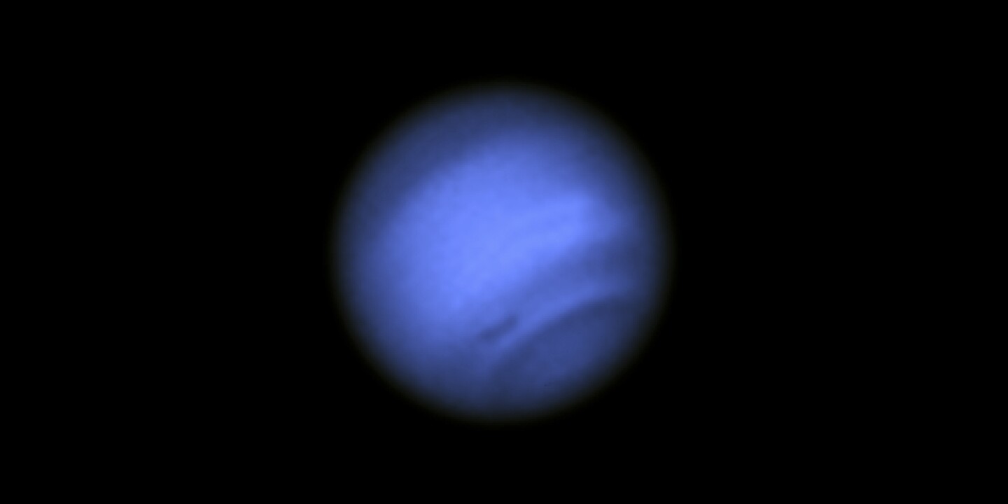 Hubble investigates dark spot on Neptune