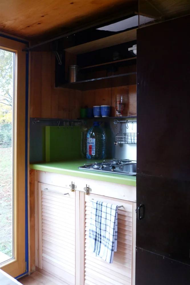 The ground level includes a kitchen and bathroom