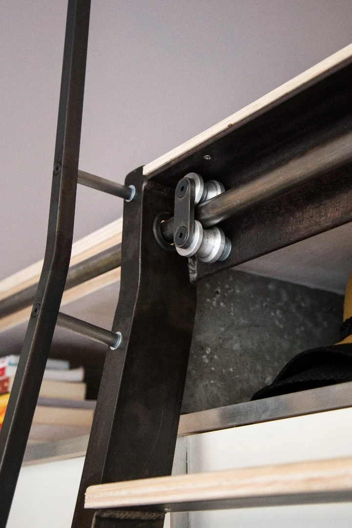 When not in use, the ladder can be slid out of the way