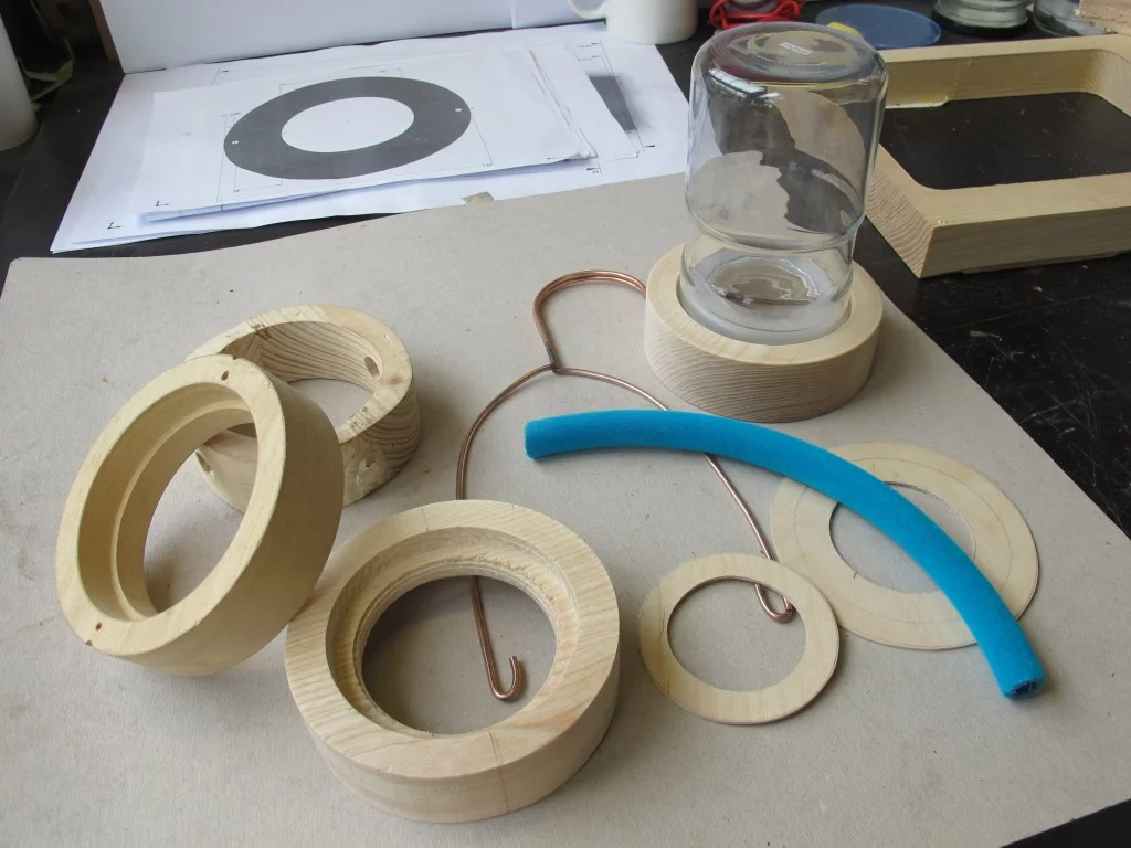 A Bye Bye Laundry clothes hanger at the construction stage, with the components laid out ready for putting together