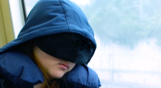 The BauBax Jacket includes a built-in neck pillow and eye mask, allowing wearers to nap at any opportunity