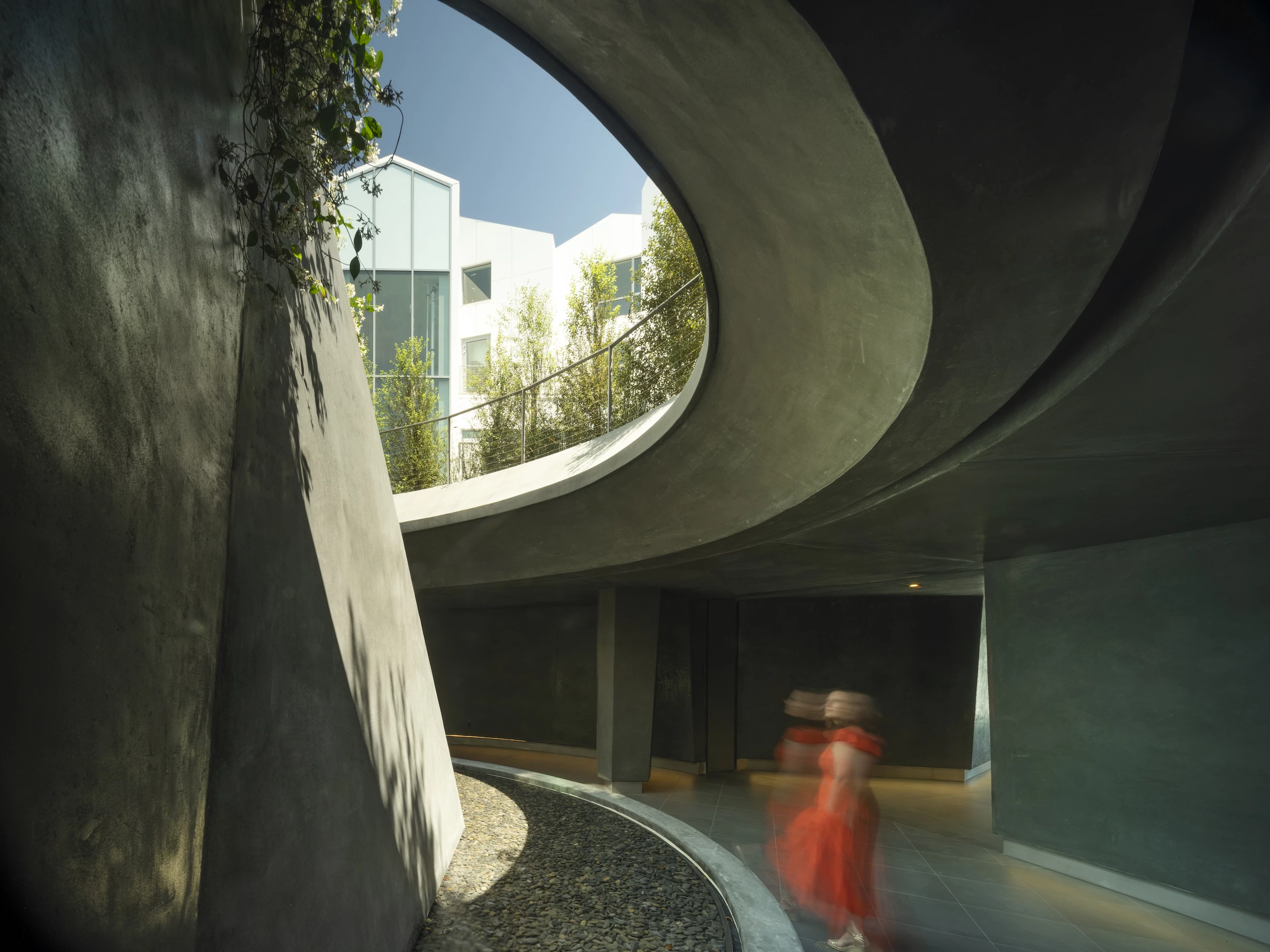 Gardenhouse is centered around a multi-level courtyard area which con