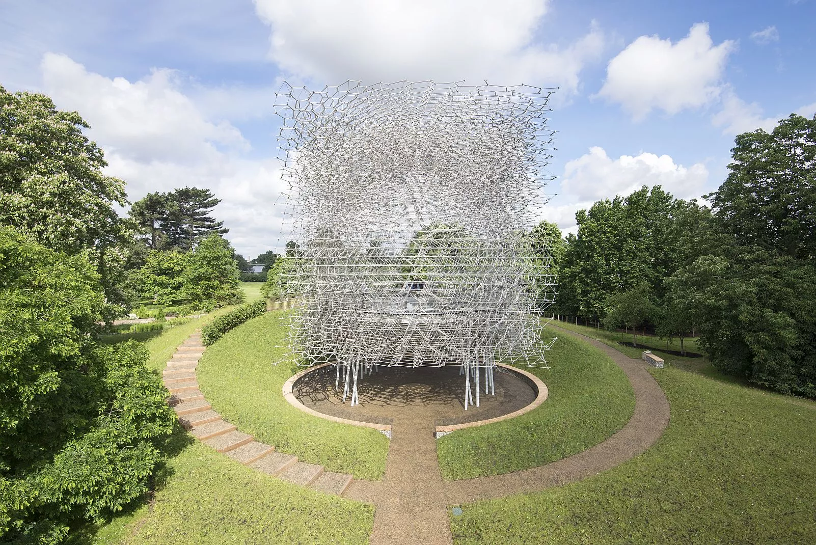 Visitors walk through a one-acre wildflower meadow to reach The Hive
