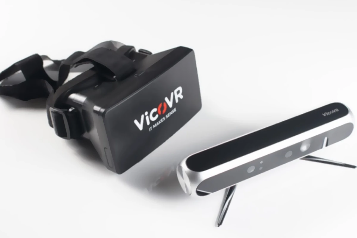 Two parts of the VicoVR system, with headset and sensor