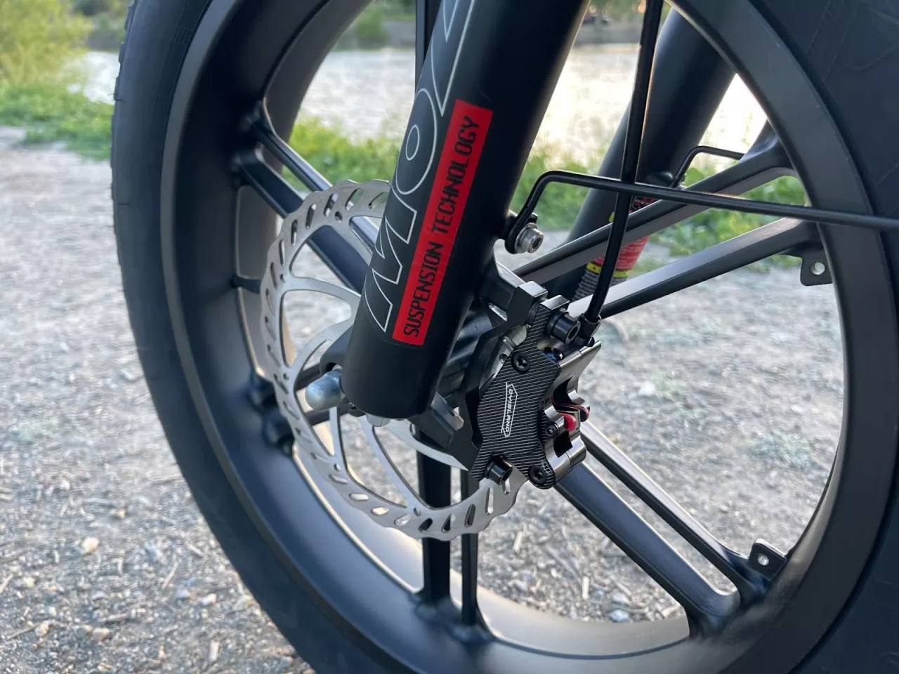 The front fork works with fat tires to give you a cushioned ride.