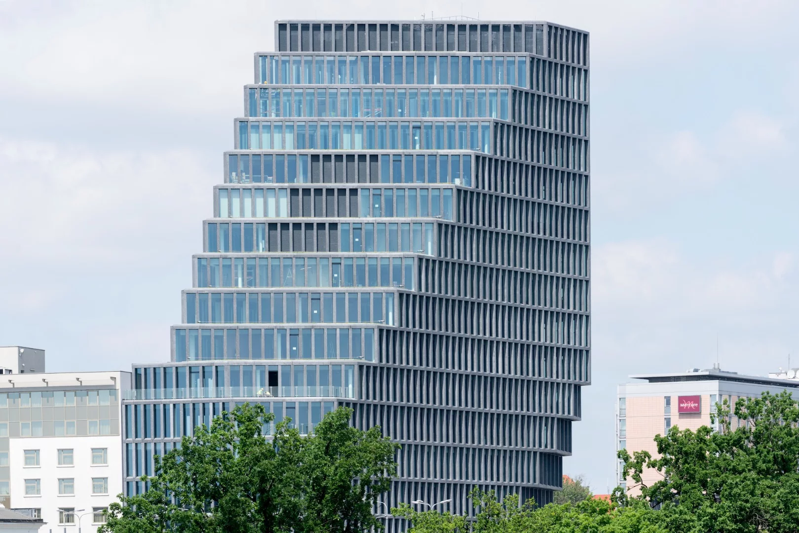 Bałtyk's facade is made up of floor-to-ceiling glass, with vertical louvers of glass fibre concrete mitigating the sun's impact