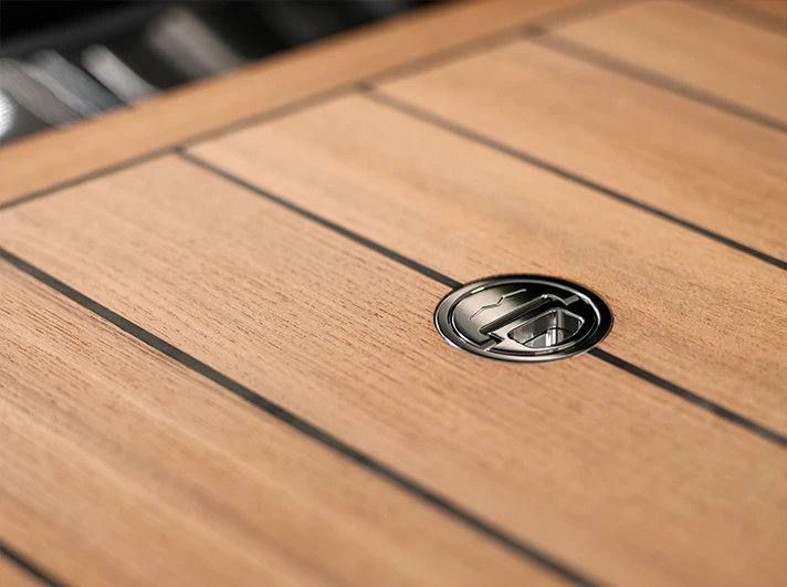 The surfaces of the outrigger hulls and decks are made from teak