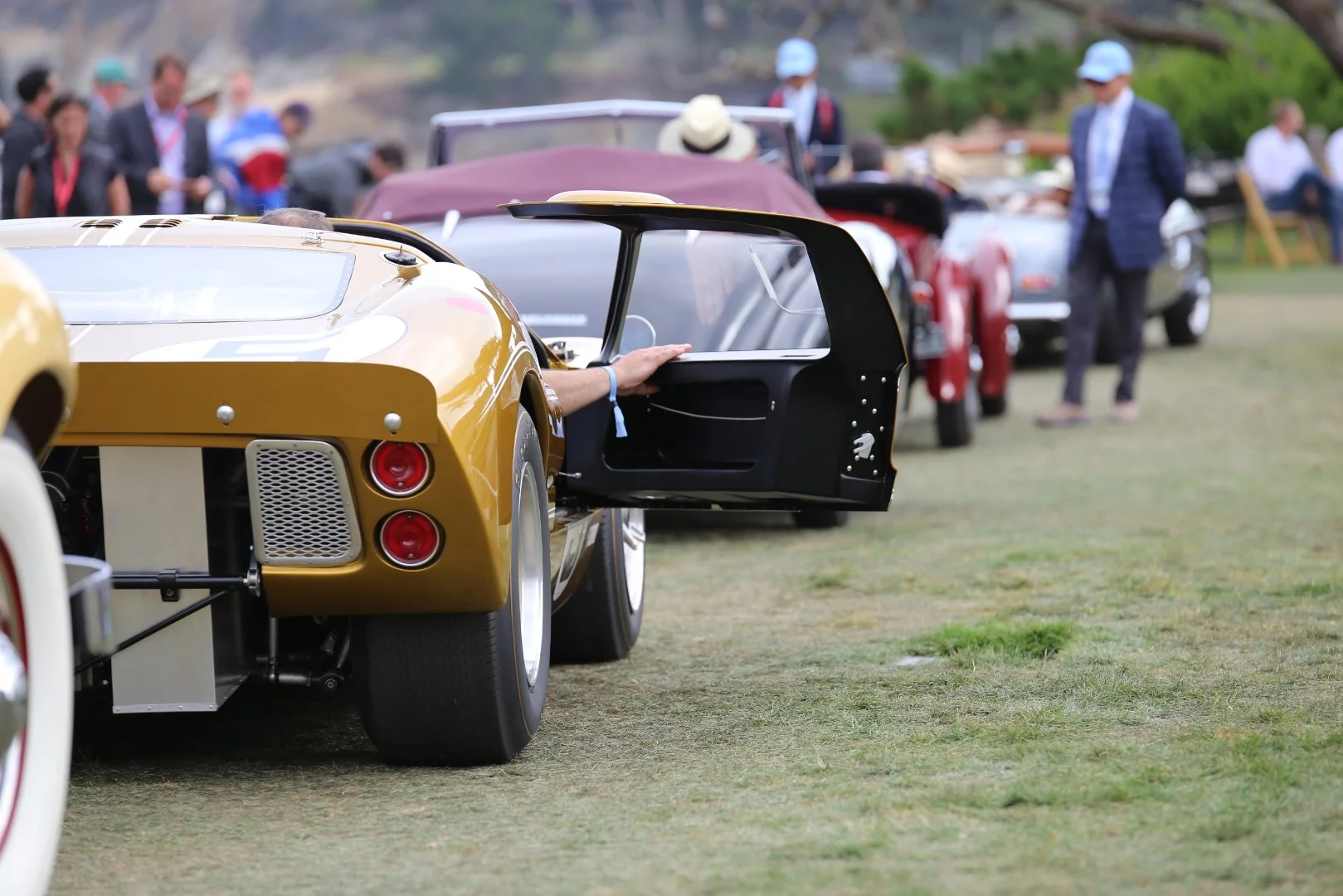 Ford GT40 leaving the event holds door open to allow cockpit heat out