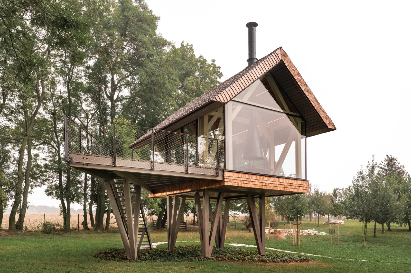 The the tiny house is raised above the ground via a series of concrete pillars