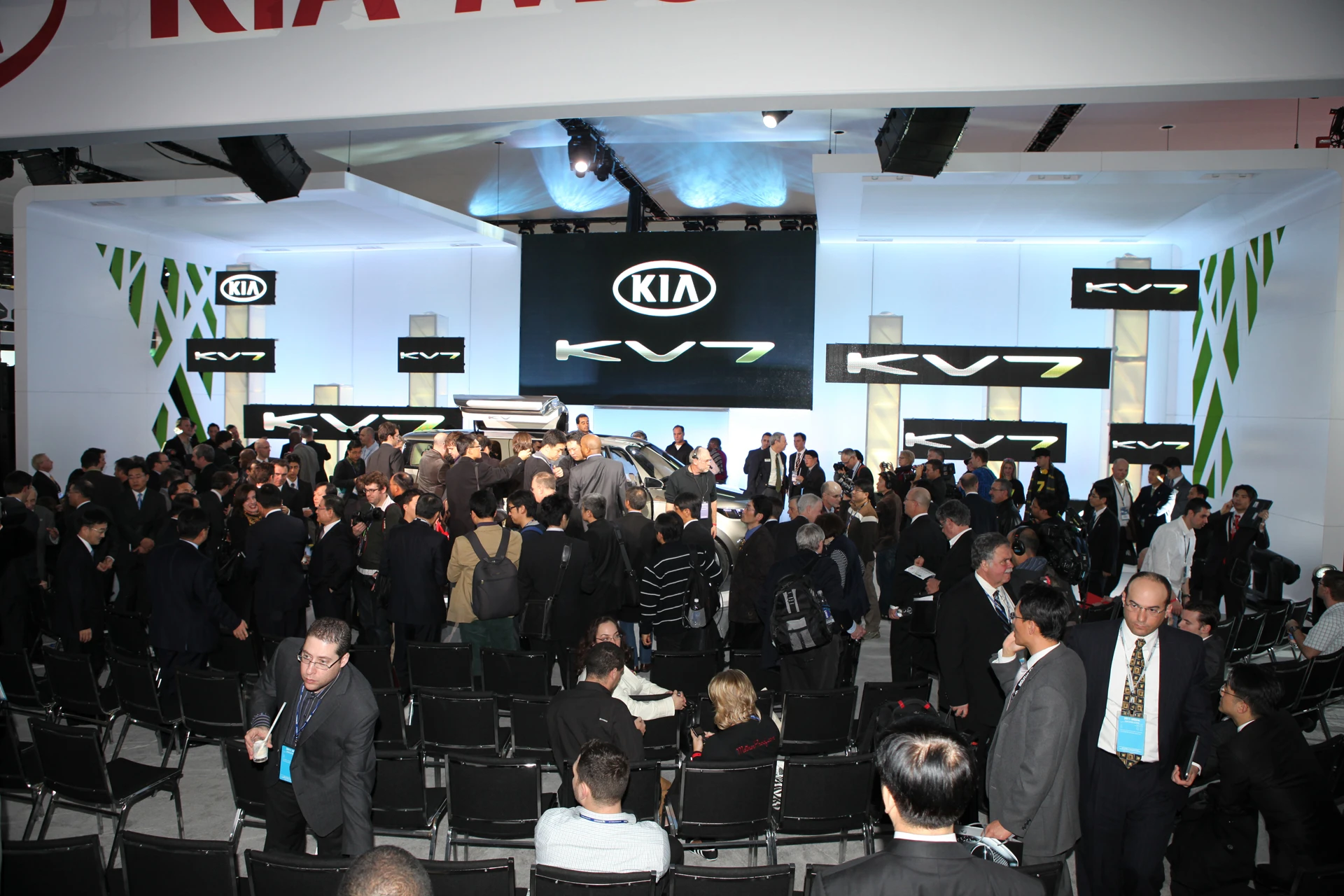 The media pack surrounds the Kia KV7 Concept at its unveiling in Detroit
