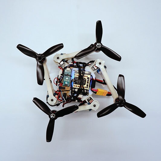 The foldable drone in its O-shaped configuration, which allows it to squeeze through narrow horizontal openings