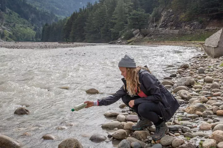 Lead author of the study Emily Duncan releases a tagged bottle into the Ganges river