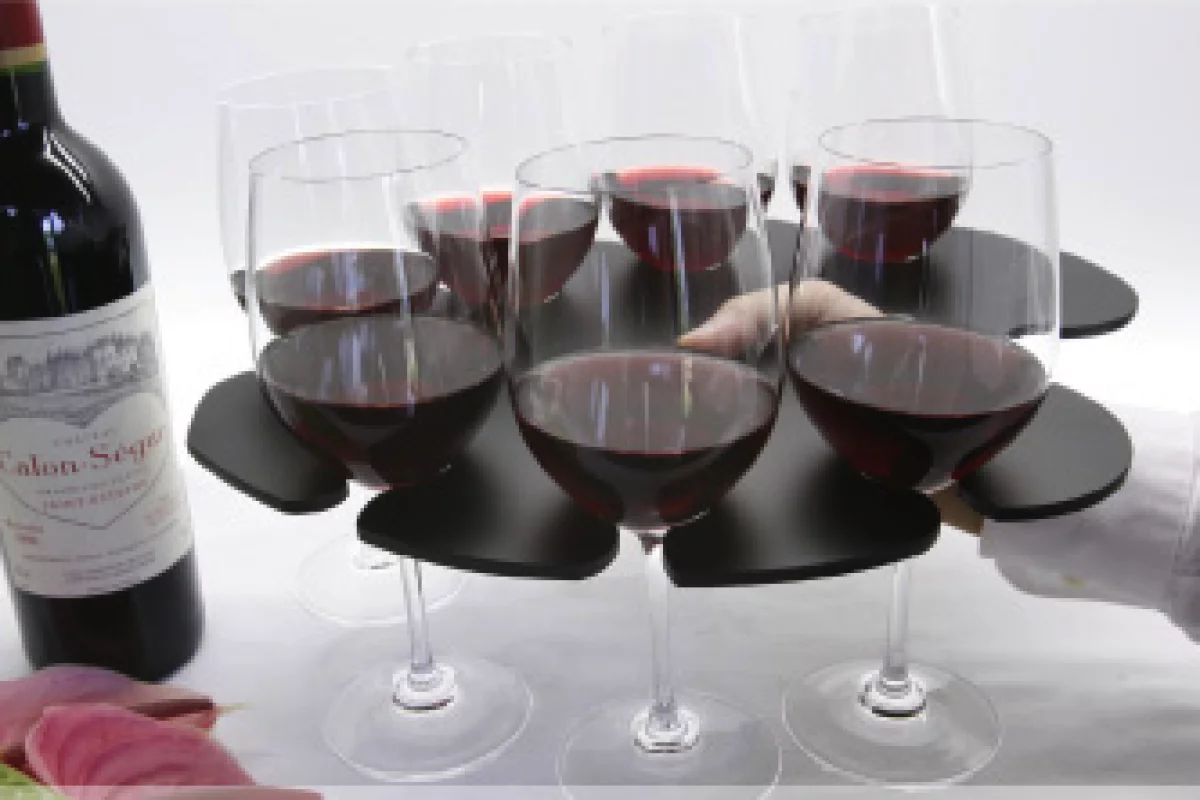 The Stem Glass Tray holds eight wine glasses in balanced formation and has a hole for your thumb