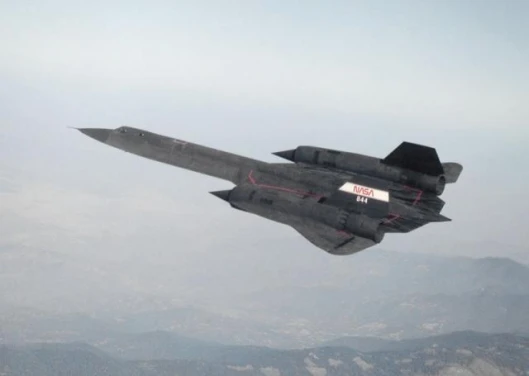 SR-71 in flight over mountains